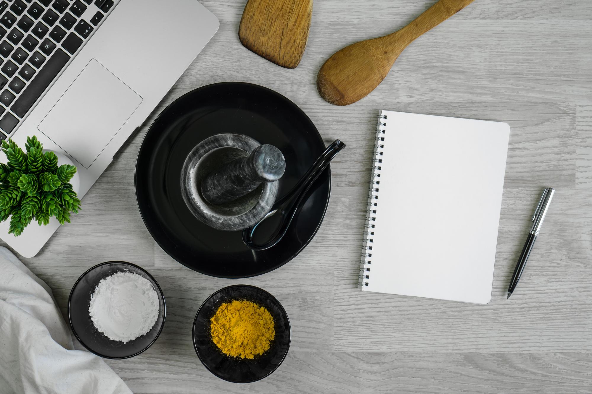 studio kitchen counter with ingredients and notebooks