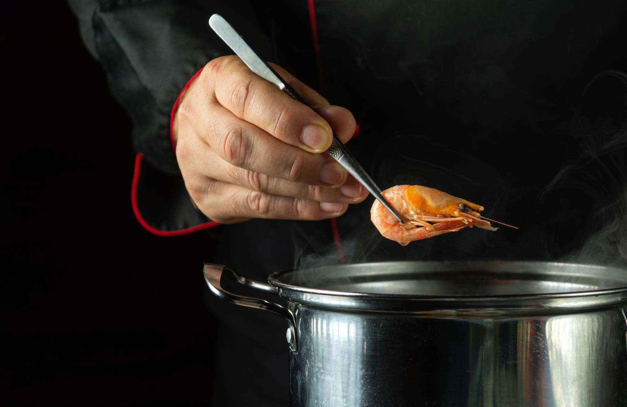 chef hands arranging garnish